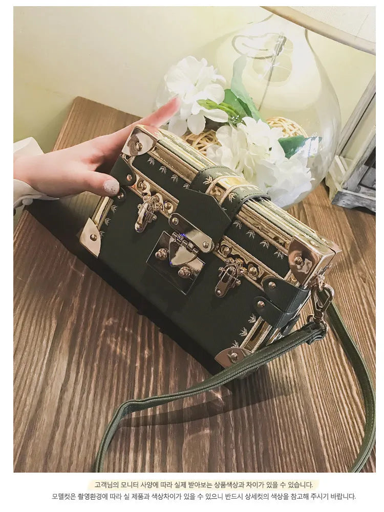 Black hard case PU leather women's shoulder bag with flap closure and cross-body strap