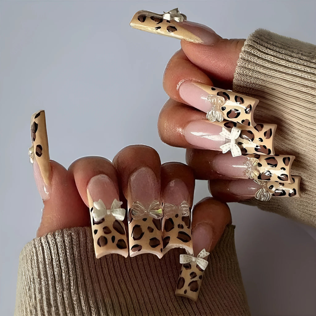 Leopard print false nails with butterfly decorations in colour WM296
