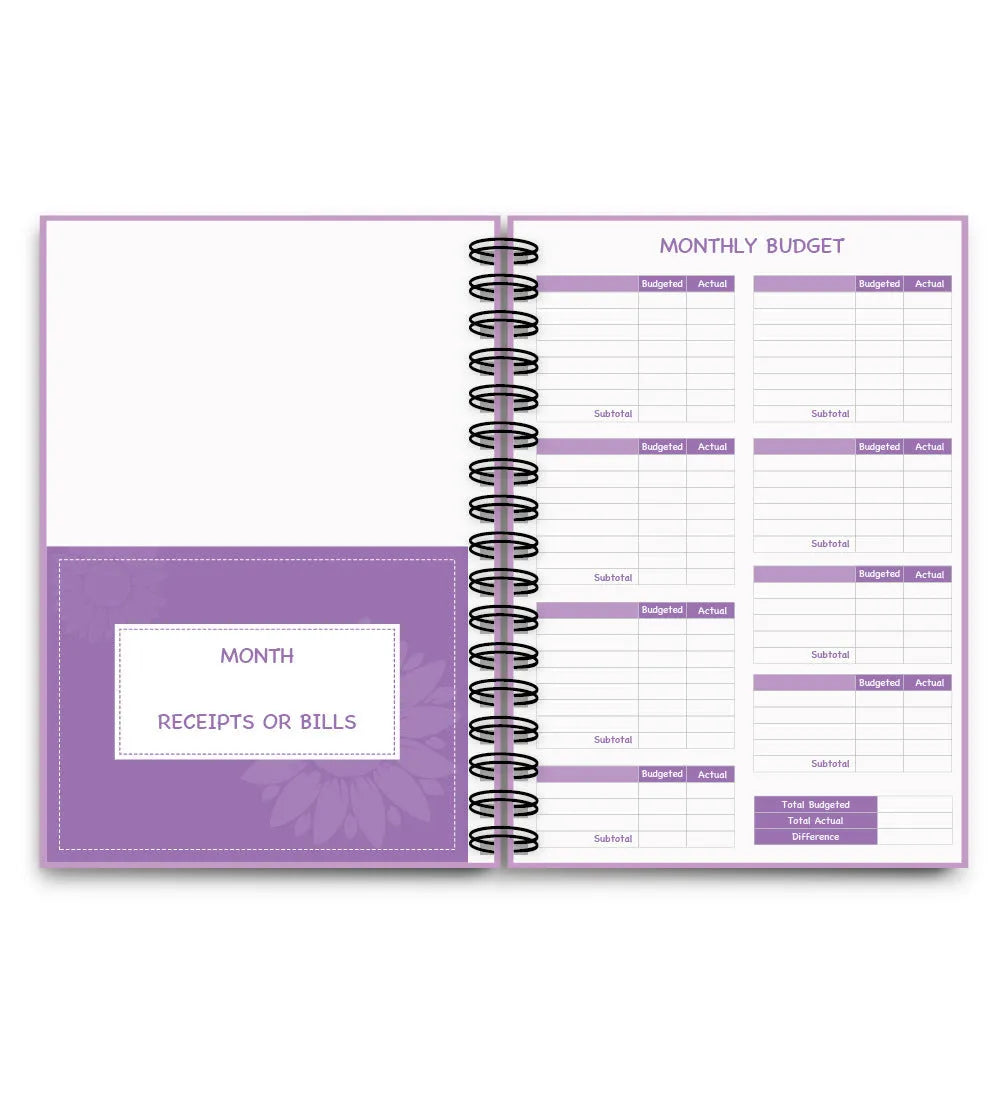 Purple coil-bound budget notebook with pen and stickers for financial planning
