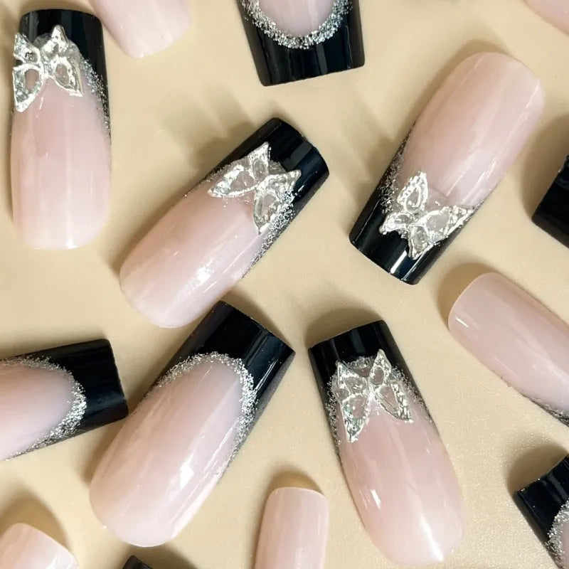 Black French style glitter butterfly nail wear armor set on a nail, showing yellow and black jelly glue colour options.