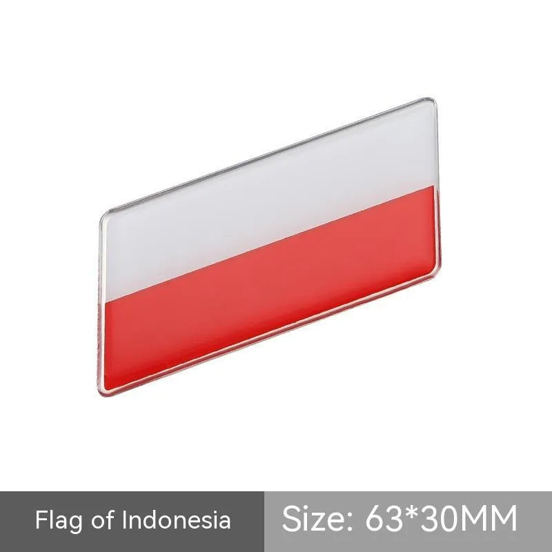Aluminium national flag car sticker in a parallelogram shape measuring 6.3 by 3 centimetres.