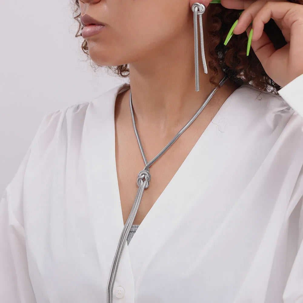 Gold electroplated titanium steel necklace with knotted tassel pendant and matching earrings set for women