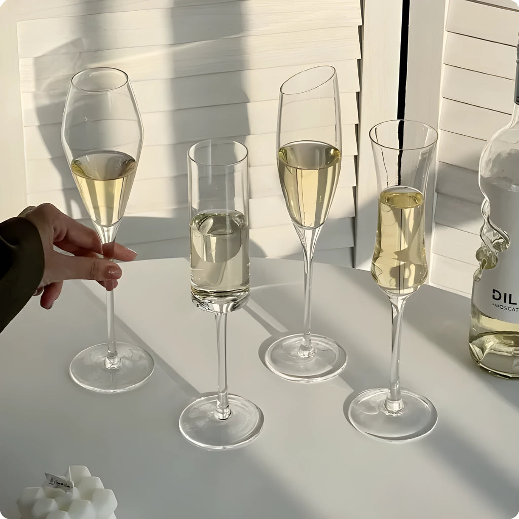 Clear glass French champagne goblet on a table.