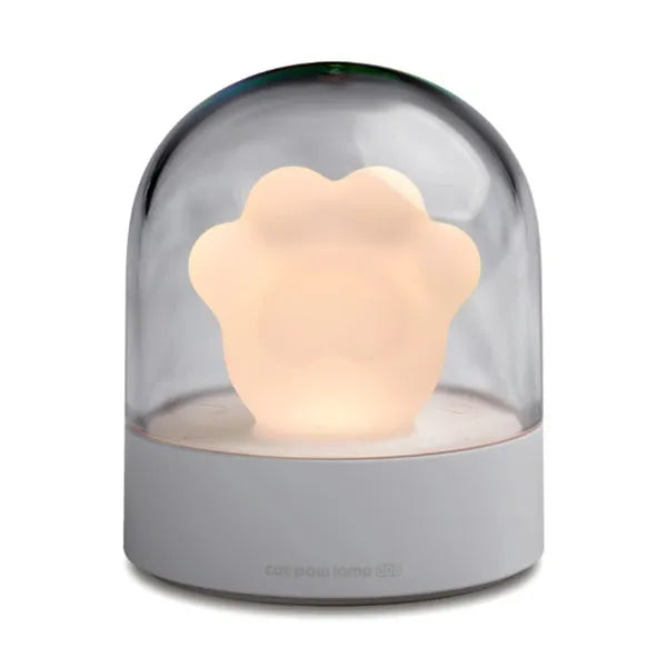 Grey and pink cat paw shaped night light with USB charging cable and musical rotation feature