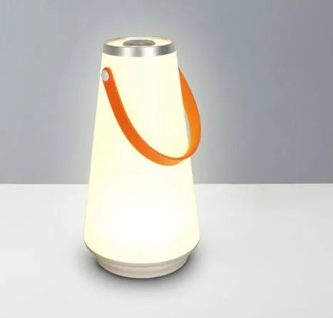 White rechargeable LED table lamp with adjustable brightness settings measuring 12x12x22cm