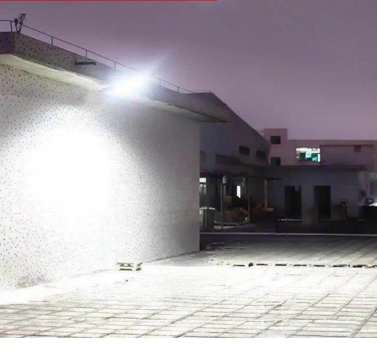 Black solar-powered motion sensor street light for outdoor garden and driveway security lighting