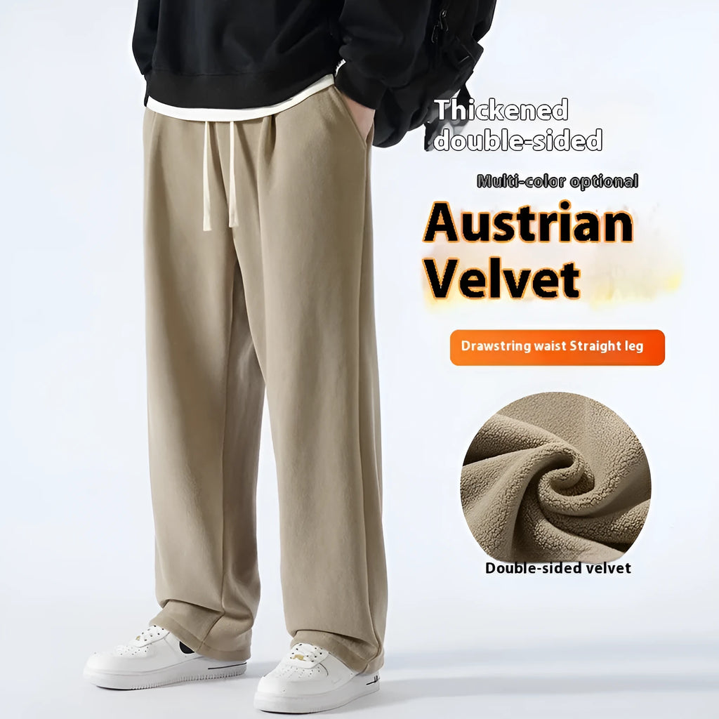 Men's loose fit apricot coloured fleece-lined sports pants with a drawstring waist on a hanger