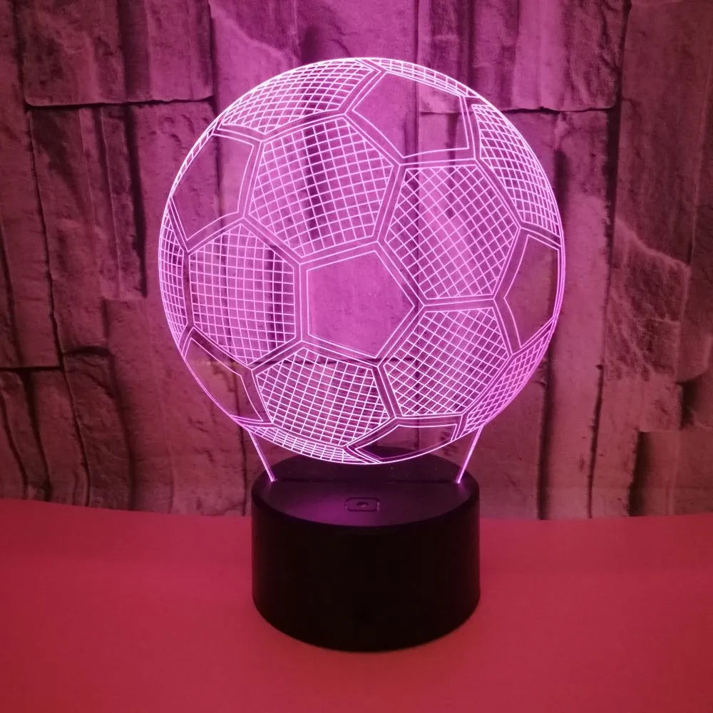 3D football shaped LED night light showing multiple colour options on a dark surface.