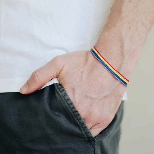 Rainbow pride bracelet with six braided wax cotton cords and silver-toned lobster claw clasp, unisex one size