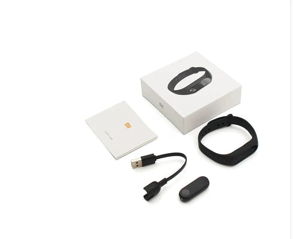 Xiaomi Mi Band 2 black fitness tracker with OLED screen on a wrist