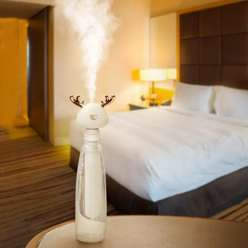 Mini USB portable car humidifier with creative little antler design in beige, showing water tank filler and USB cable