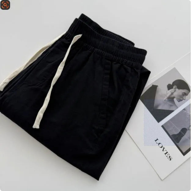 Men's loose straight-leg casual summer pants in beige with a drawstring waistband.