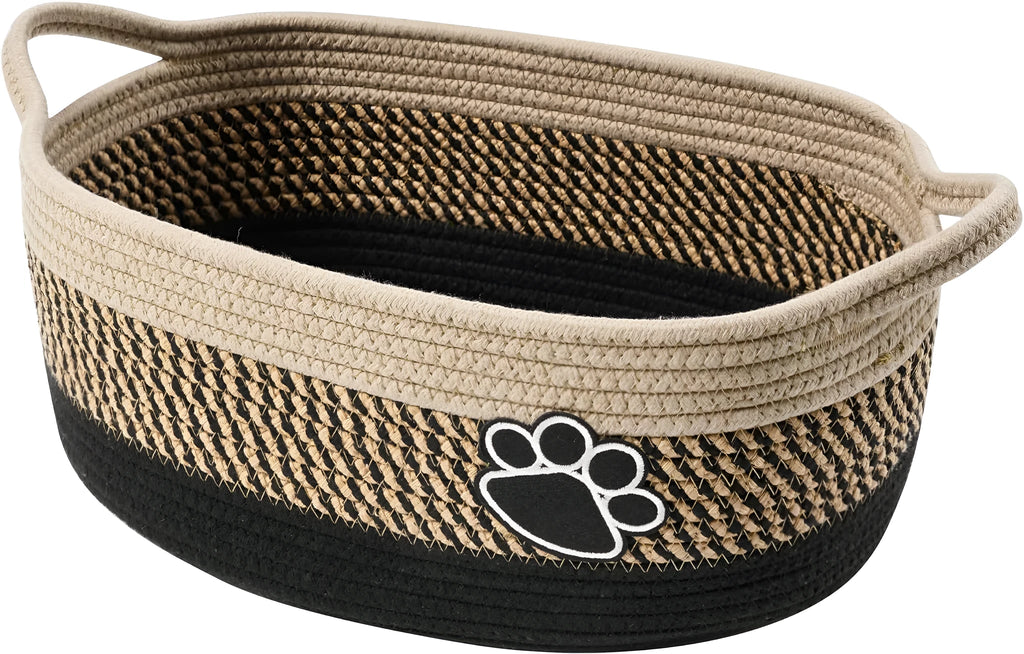 Light beige handmade cotton rope storage basket with wooden base and handle on a wooden floor
