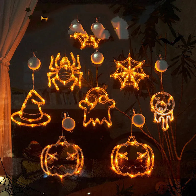 Halloween LED window lights showing spider, pumpkin and ghost designs with suction cup mounting