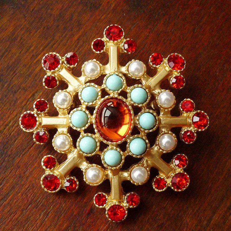 A diamond-shaped Retro Court Baroque vintage brooch made from zinc alloy, showing ornate detailing.