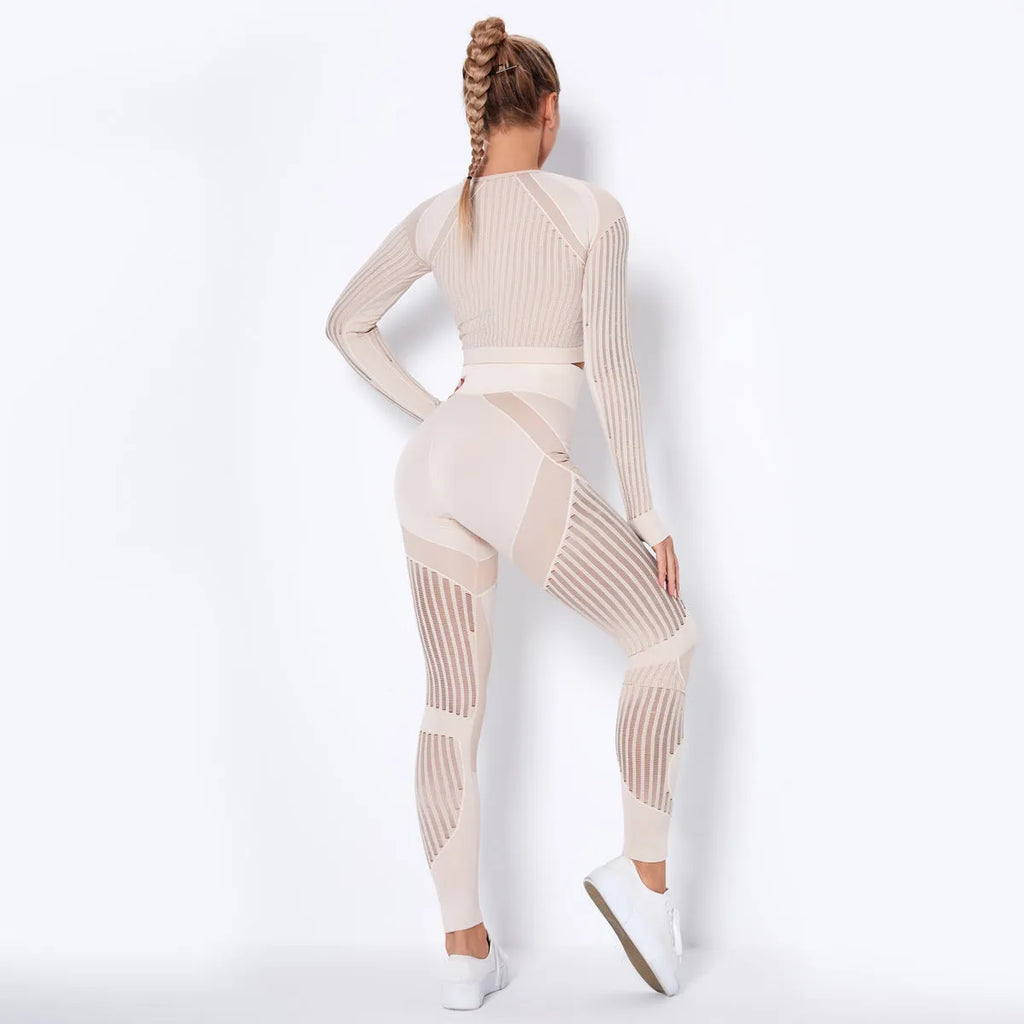 Seamless knitted long-sleeved yoga suit for women in a solid colour, showing full-length design.