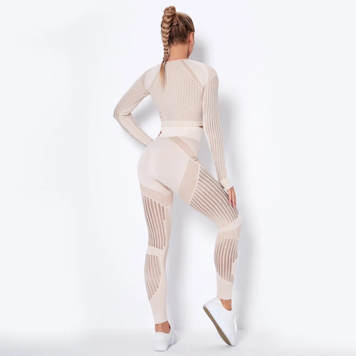 Seamless knitted long-sleeved yoga suit for women in a solid colour, showing full-length design.