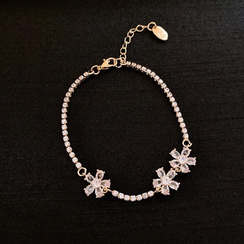 Women's gold copper bracelet with geometric design and inlaid zircon stones