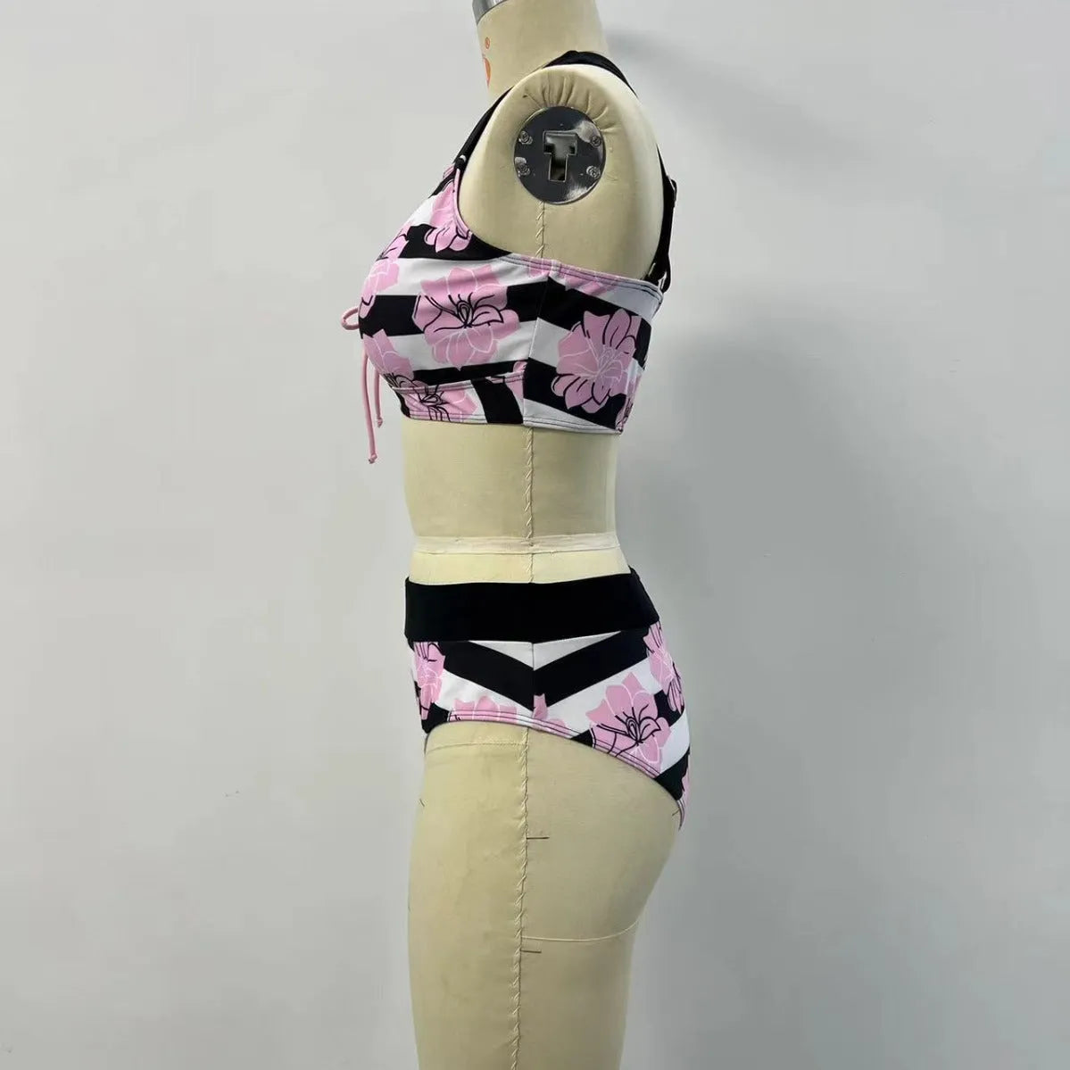 Black printed women's bikini swimsuit with belly covered slimming design.