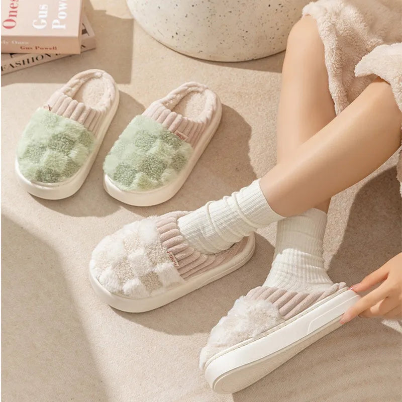 Women's plaid patterned plush slippers with a non-slip PVC sole, shown in a selection of colours including coffee, green, and pink.