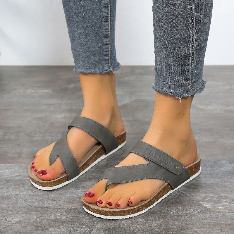 Flat thick-soled flip-flops with a toe ring strap in blue, showing artificial PU upper and foam sole.