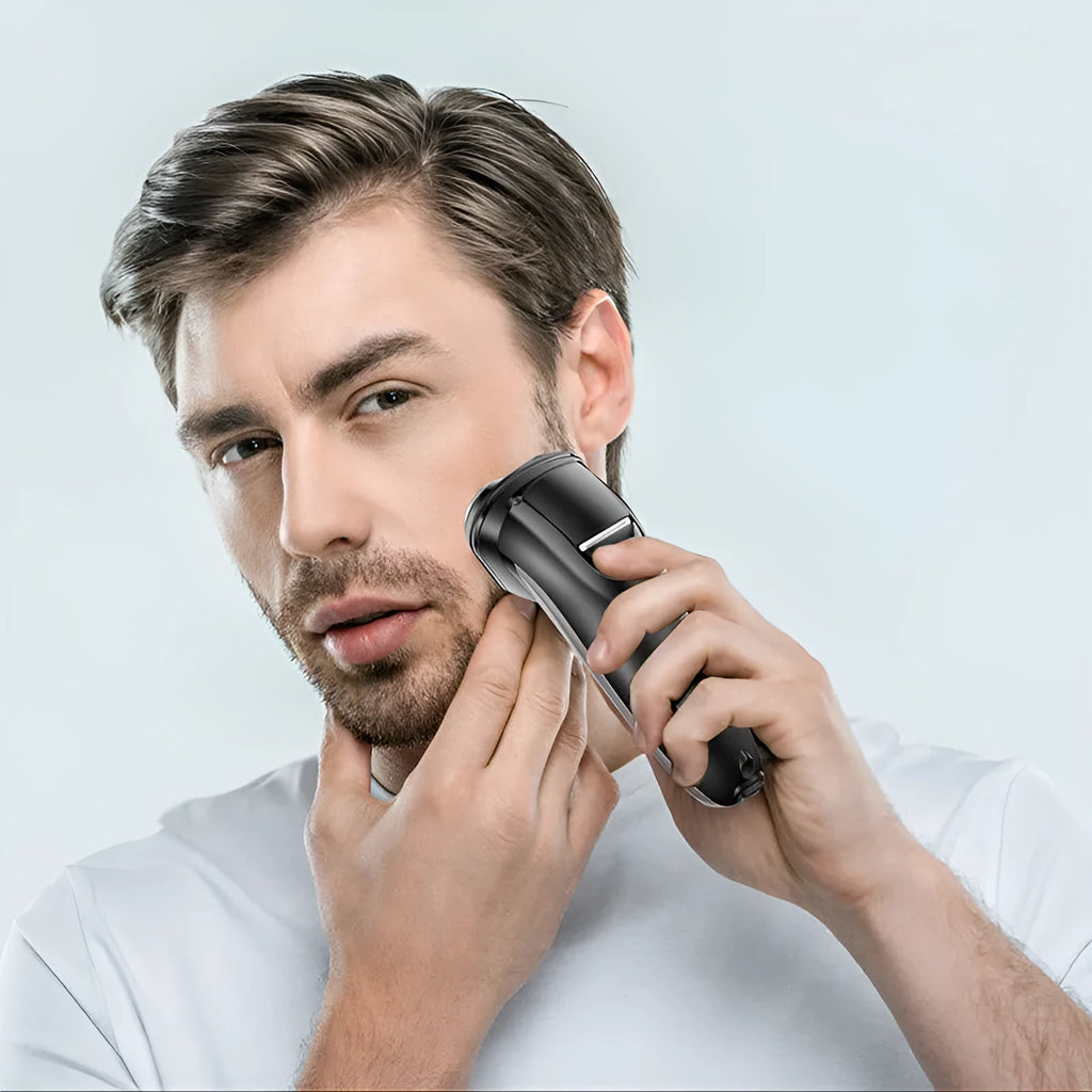 Men's electric shaver with three floating cutter heads and pop-up sideburn trimmer in grooming kit