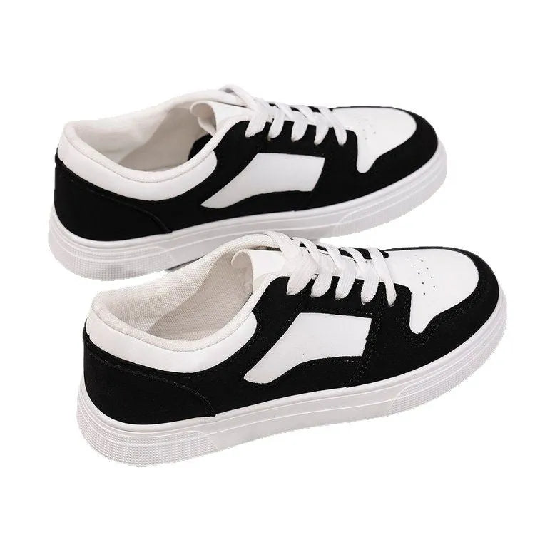 Black women's casual sports shoes with round toe, lace-up front, and flat rubber sole.