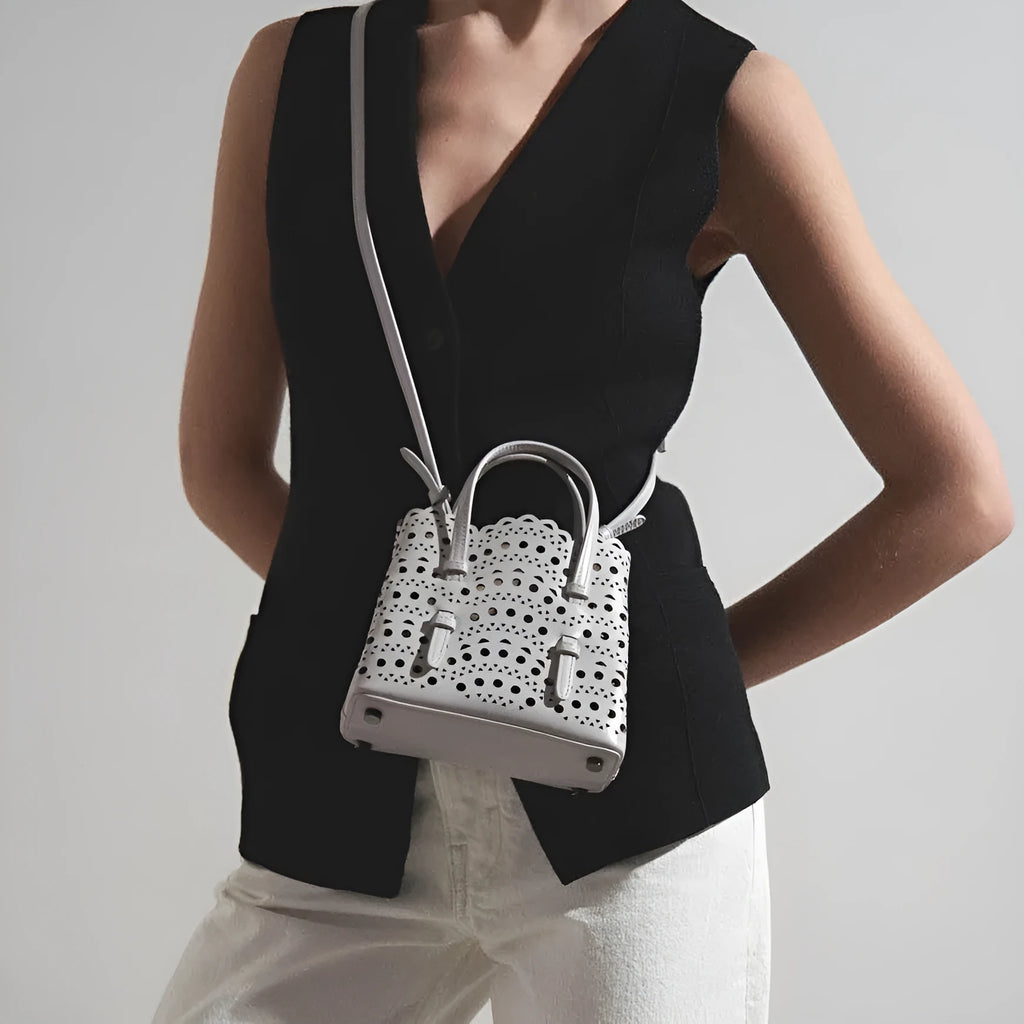 Horizontal square hollow carved PU messenger bag with three shoulder straps in apricot colour