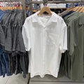 Man wearing a beige open collar modal cotton blend casual shirt with regular sleeves.