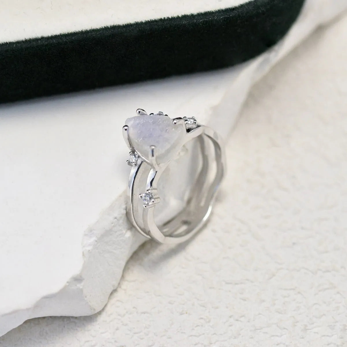 S925 sterling silver geometric ring with irregular triangle shape and moonstone detail in gold tone finish