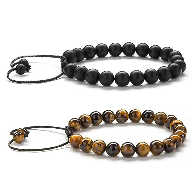 Matte black agate bead couple bracelets with a geometric design on a white background.