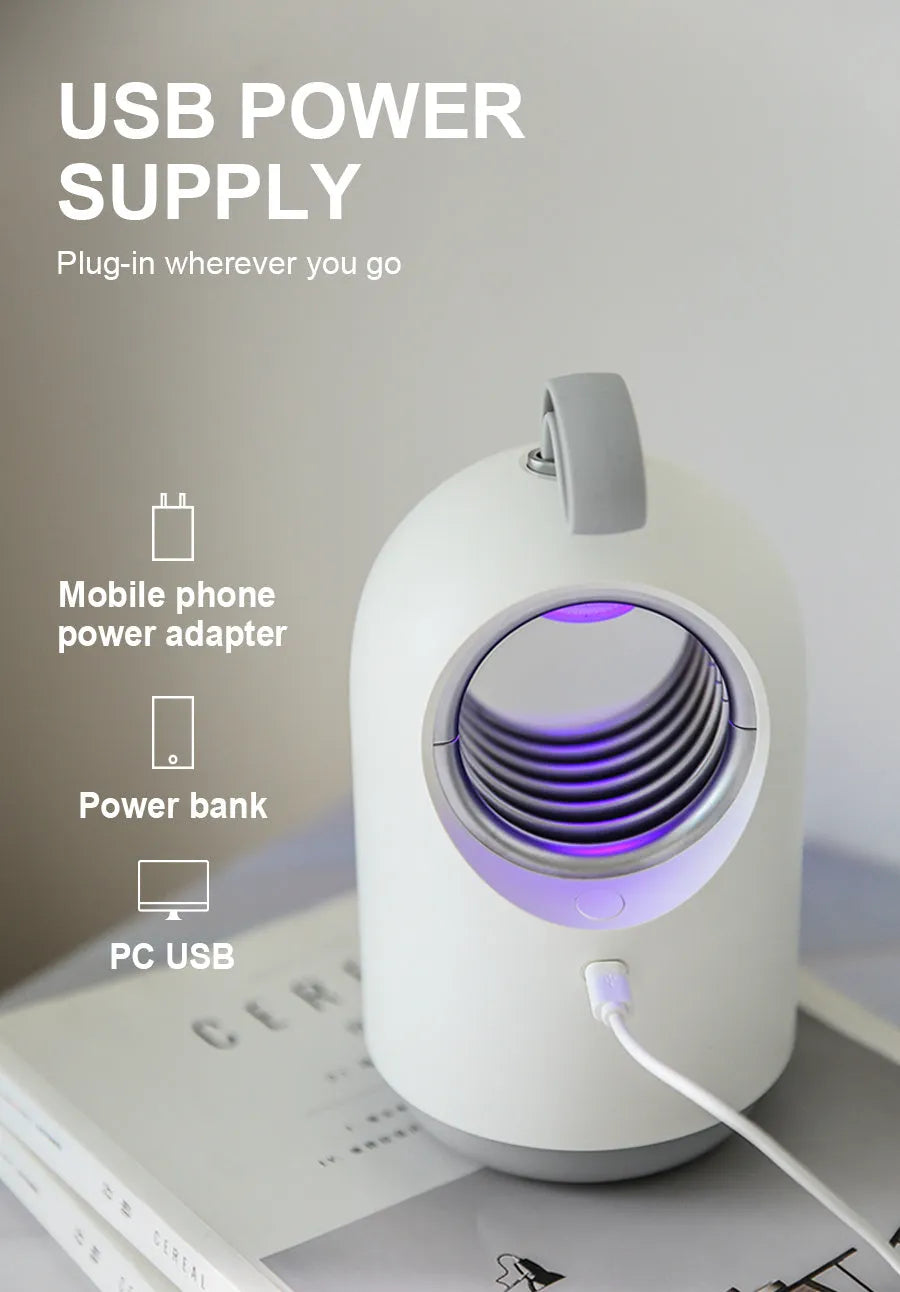 White and blue household mosquito killer lamp with UV light, silicone handle, and USB cable.