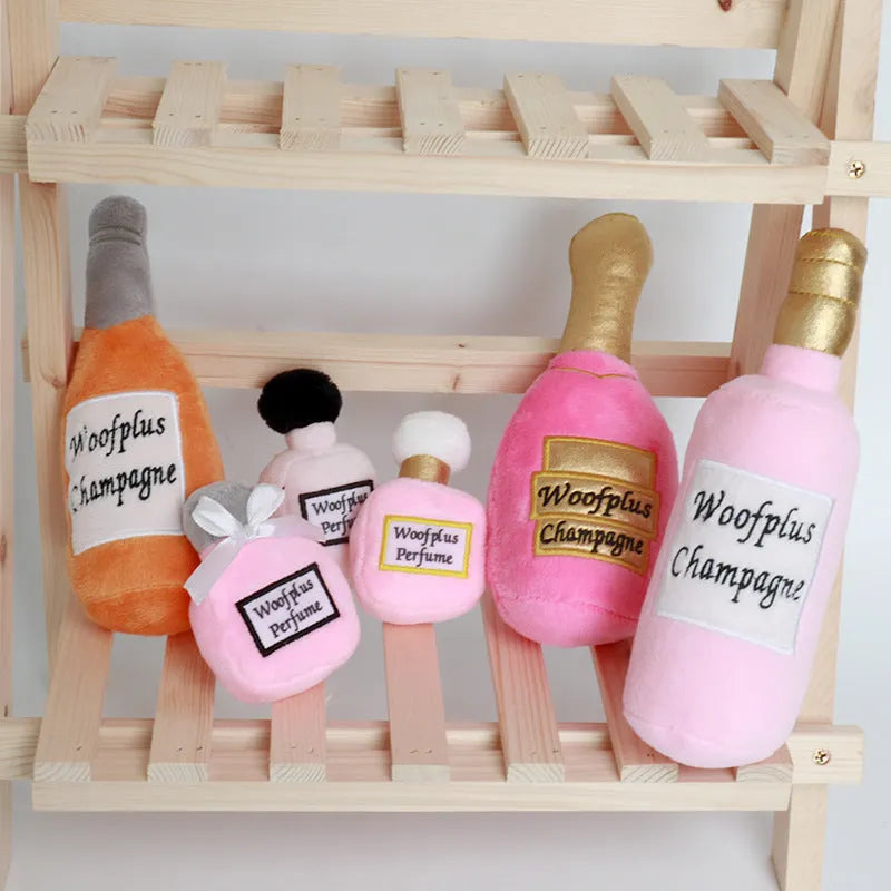 Soft plush pet toy in the shape of a wine bottle, shown in multiple colour options.