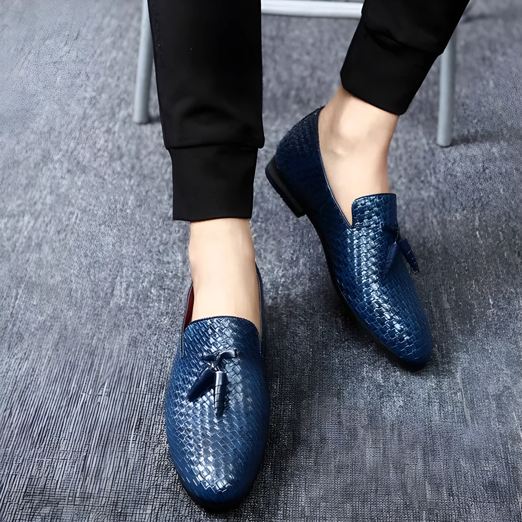 Anyaman men's woven loafers in black with soft sole, side view showing handcrafted weave texture