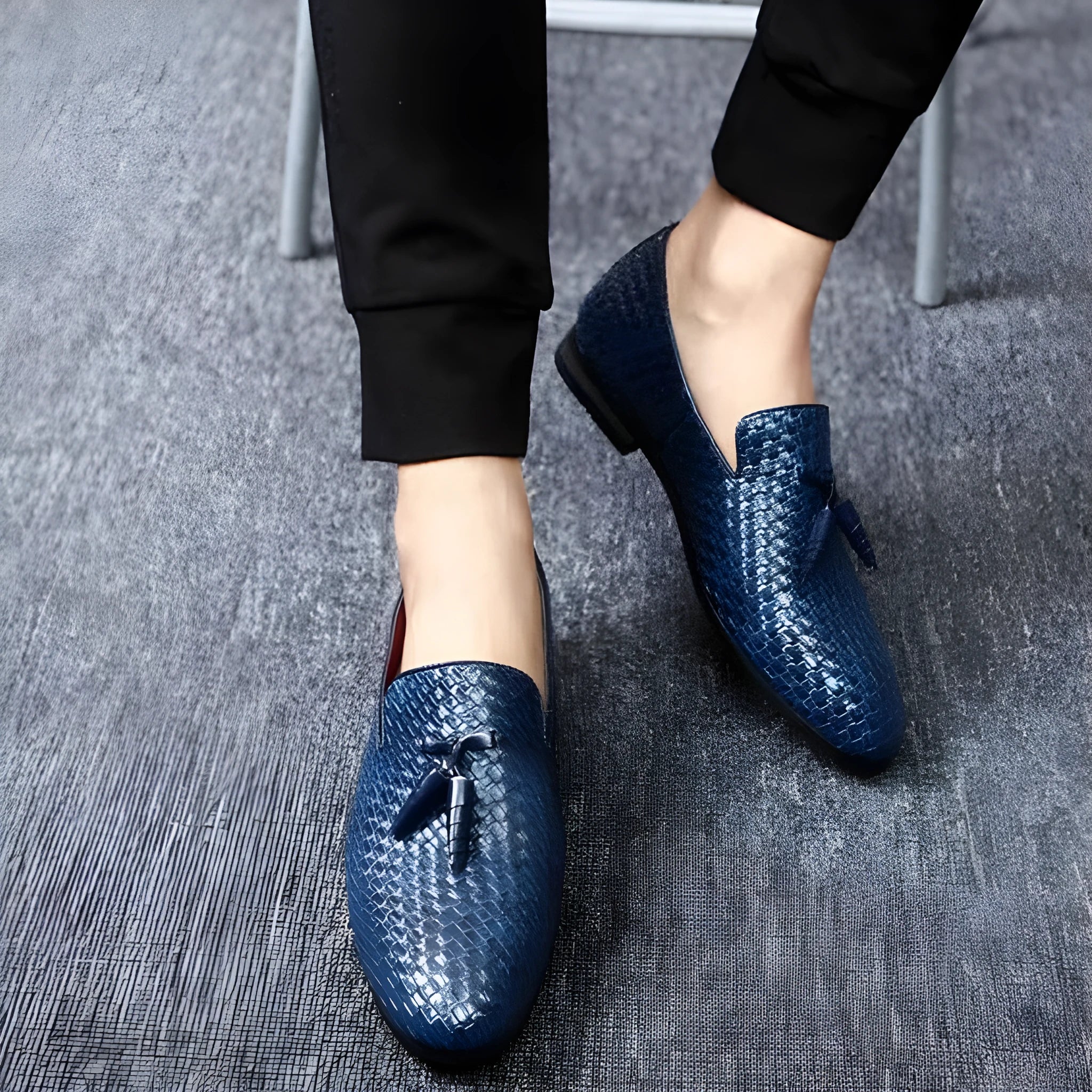 Anyaman men's woven loafers in black with soft sole, side view showing handcrafted weave texture