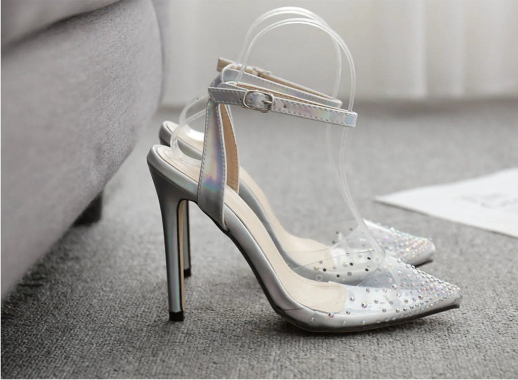 Women's pointed toe stiletto sandals with diamond details on a PVC upper.