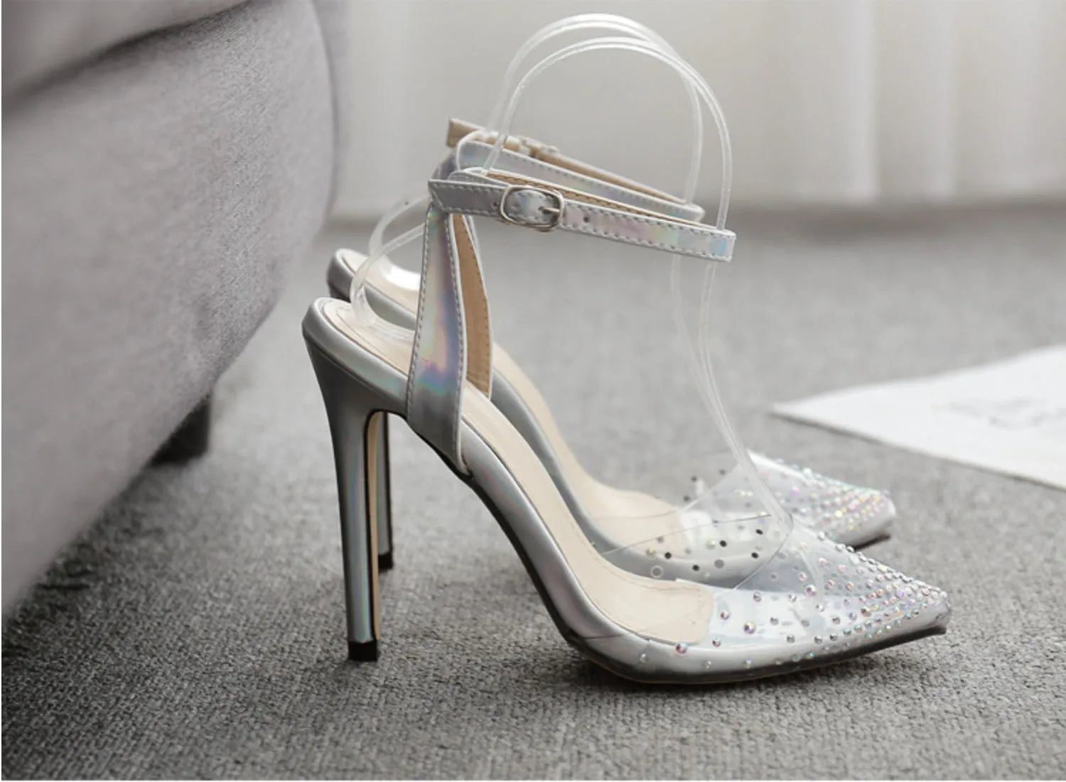 Women's pointed toe stiletto sandals with diamond details on a PVC upper.