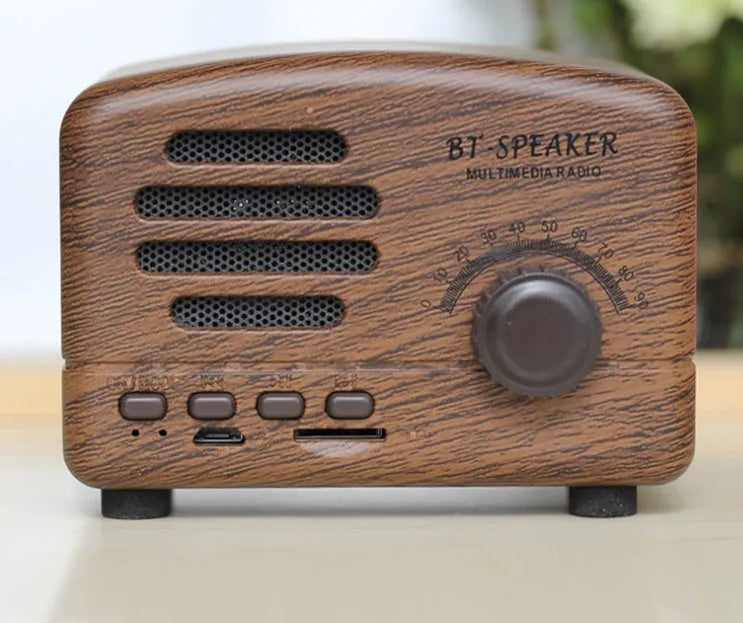 Vintage wood finish Bluetooth speaker in compact plastic housing with USB charging port