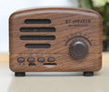 Vintage wood finish Bluetooth speaker in compact plastic housing with USB charging port