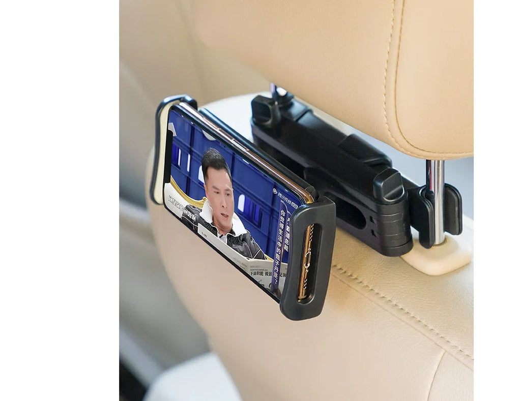 Black car phone holder mounted on vehicle rear seat base with tablet secured in adjustable grip