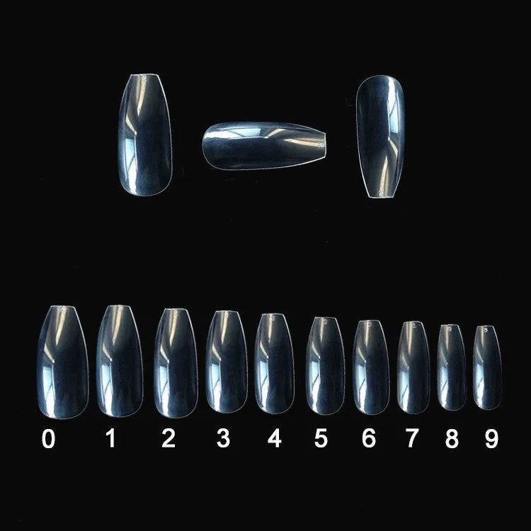500 clear acrylic false nails in 10 sizes, made from ABS plastic, arranged on a table.