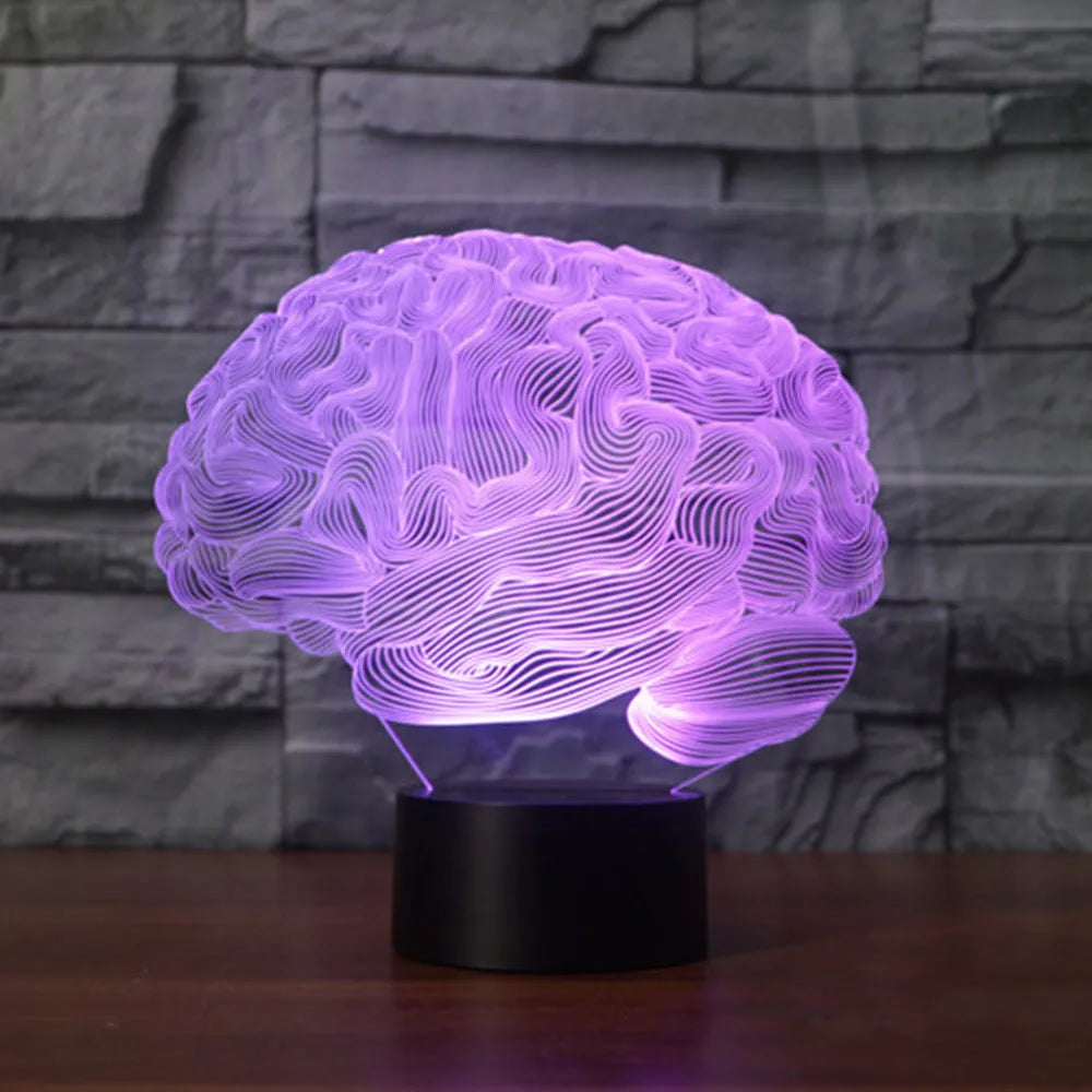 LED 3D acrylic illusion desk lamp with colourful remote control on a wooden table