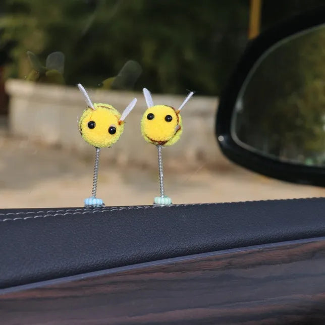 Small furry brown and yellow cartoon bee car decoration ornament measuring 3cm