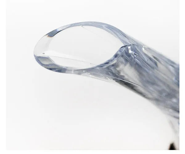 Clear acrylic wine aerator with stainless steel filter measuring 16x4.2cm pouring red wine into a glass