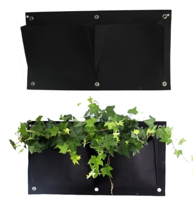 Vertical 7-pocket felt planter bag hanging on a wall with green plants growing from the pockets