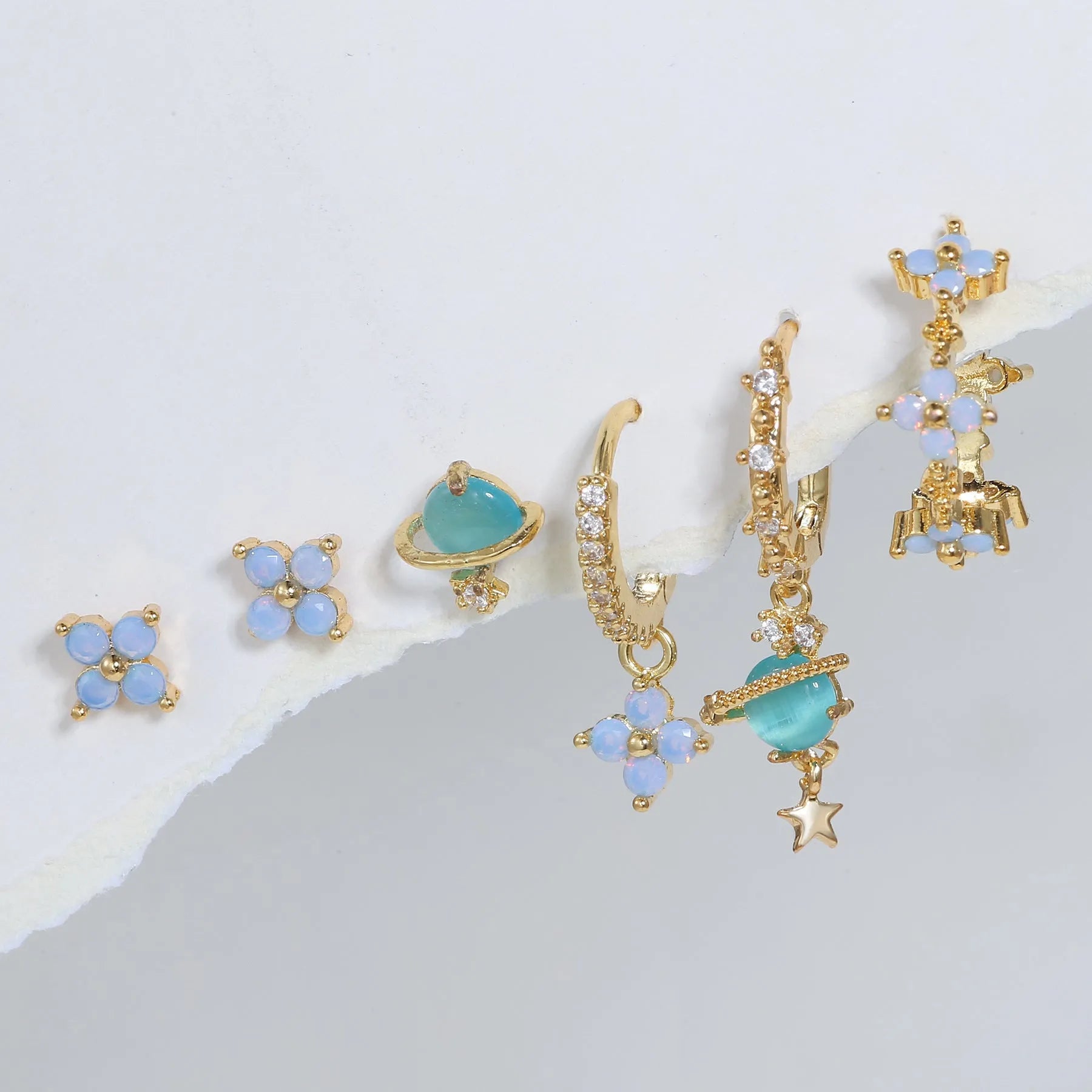 Gold and silver flower nail design ear studs with zircon mosaic accents in Japanese Korean style