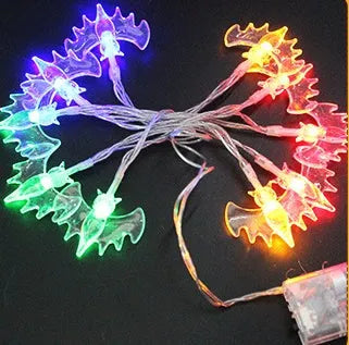 Halloween decoration LED string lights with 10 LED heads including pumpkin, bat, and ghost pendants on a dark background