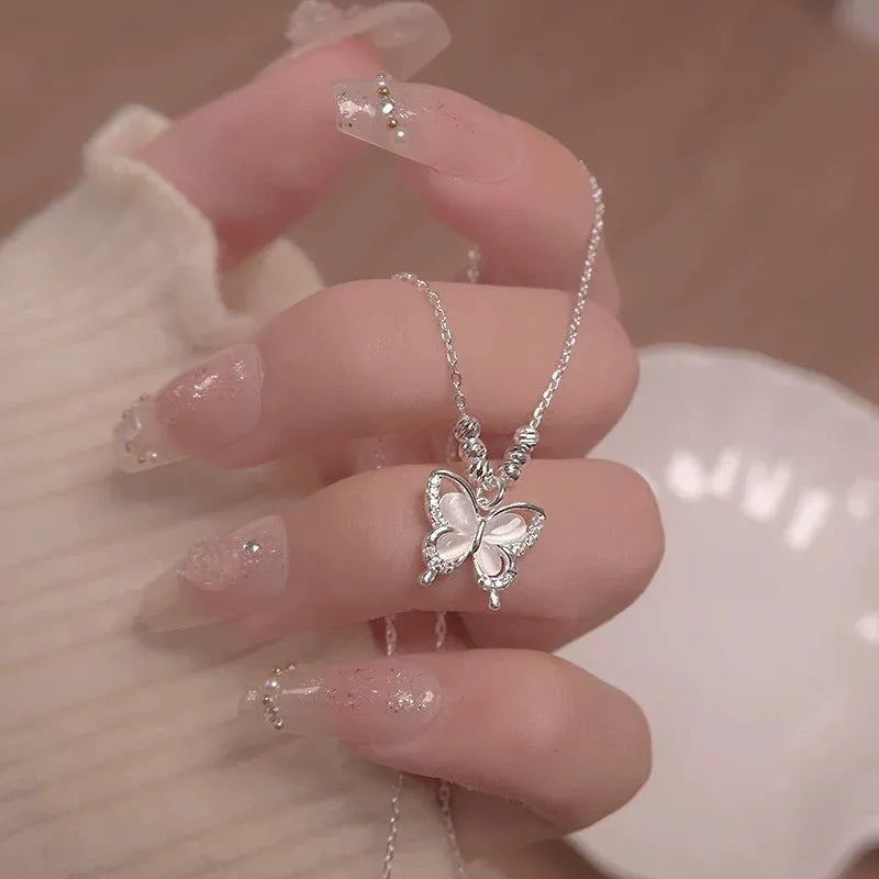 Silver butterfly necklace with square line opal detail on cross chain