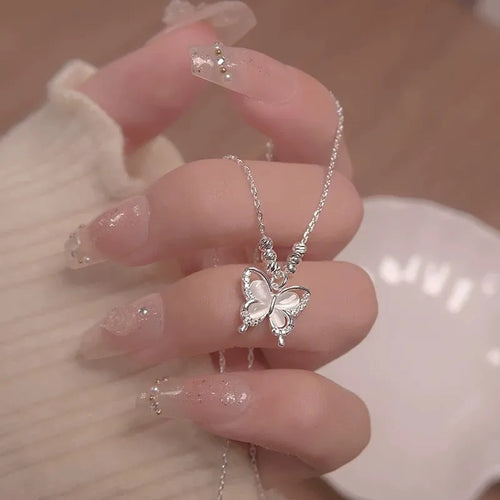 Silver butterfly necklace with square line opal detail on cross chain