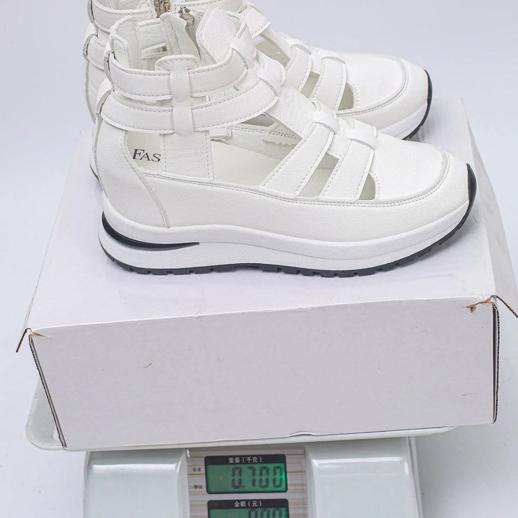Women's black hollow-out platform sandals with a Velcro strap and round toe.